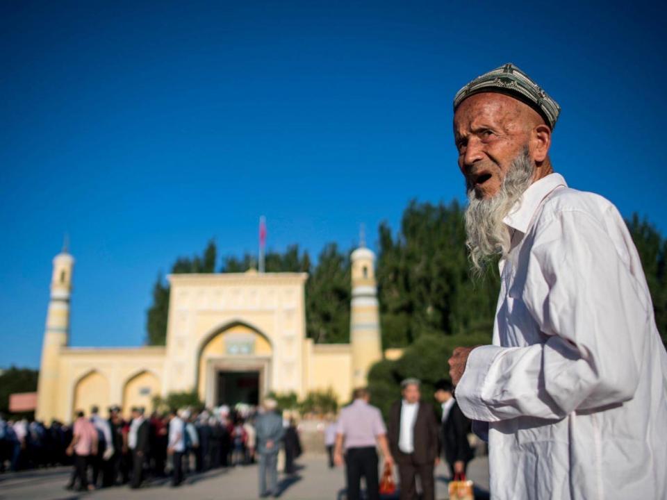 An elderly man stands near a mosque in China’s Xinjiang province. (AFP/Getty)