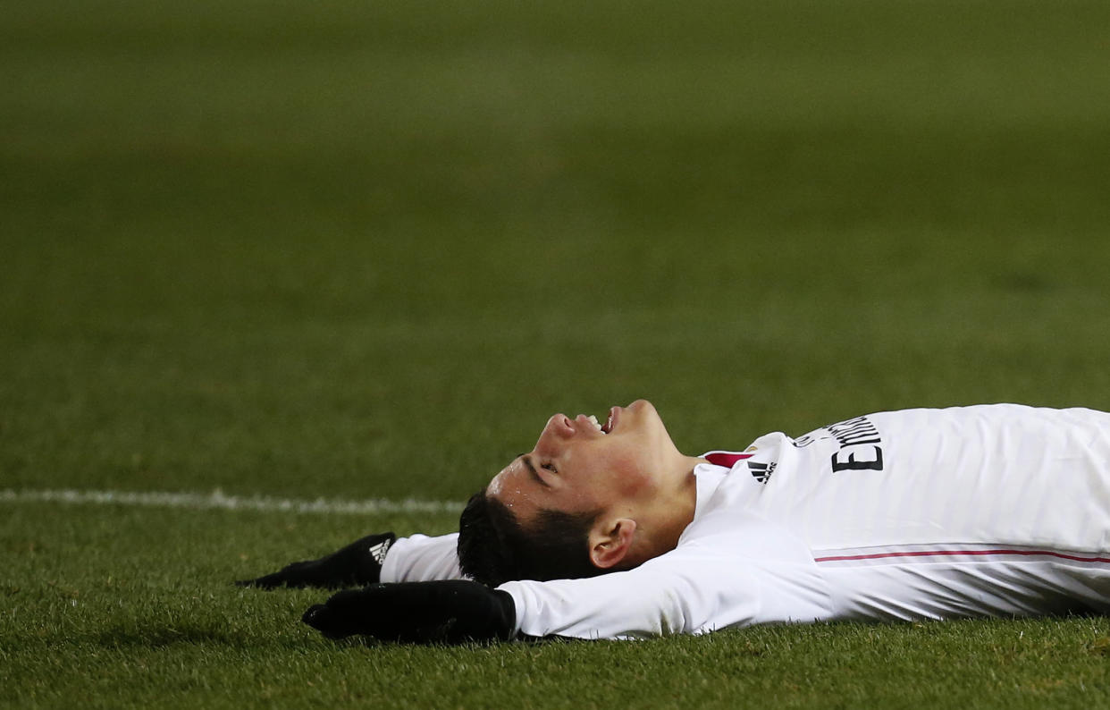 Real Madrid's James Rodriguez lies on the ground during their Spanish King's Cup soccer match against Atletico Madrid at Vicente Calderon stadium in Madrid January 7, 2015. REUTERS/Juan Medina (SPAIN - Tags: SPORT SOCCER)