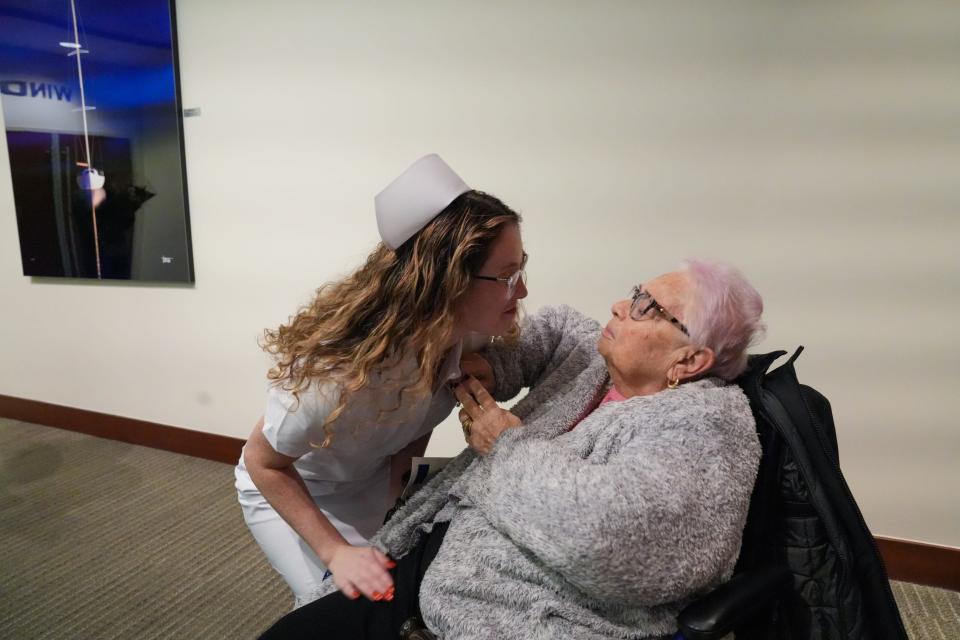 Becca Seay gets pinned by her grandmother, a longtime nurse and Wilmington resident, Elizabeth "Betty" Grace, during the nursing graduation pinning ceremony in December 2023.