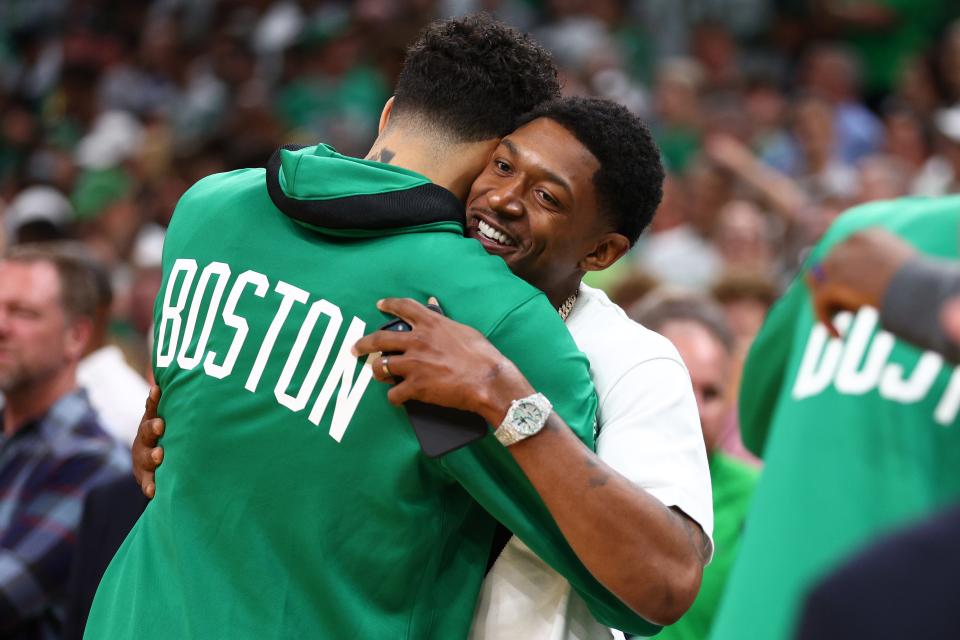 Jayson Tatum of the Boston Celtics hugs Bradley Beal of the Washington Wizards prior to Game Four of the 2022 NBA Finals against the Golden State Warriors at TD Garden on June 10, 2022 in Boston, Massachusetts.