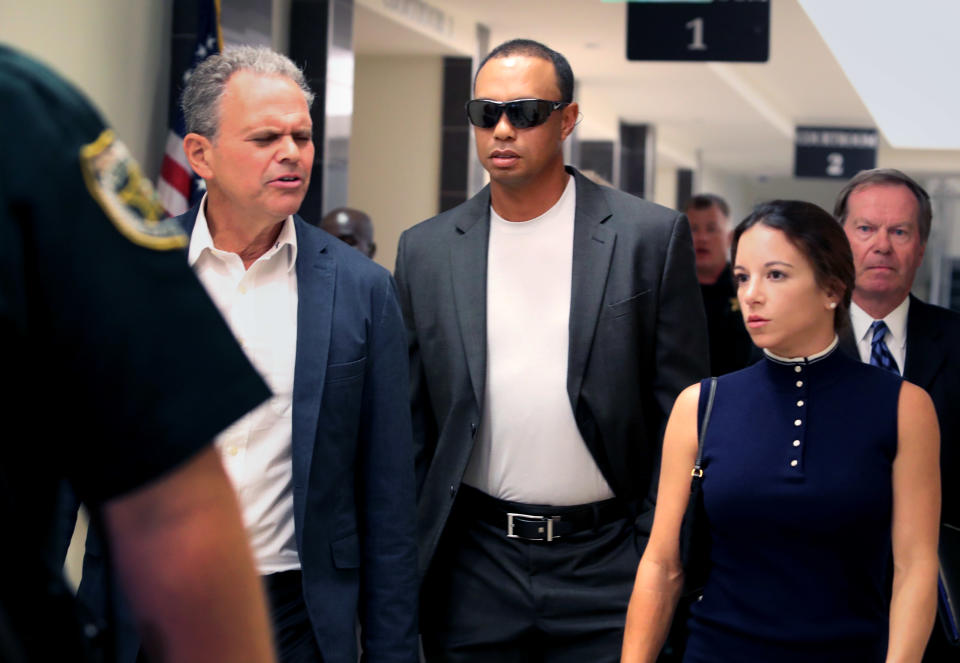 Tiger Woods left Palm Beach County (Fla.) court after resolving his May DUI charge. (AP)