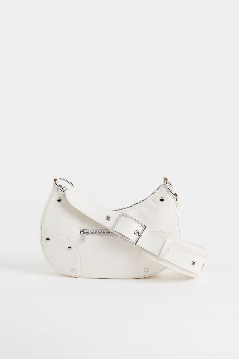 <p>If you like something a little edgy, try this <span>H&amp;M Small Shoulder Bag</span> ($20, originally $25). It's got a modern look but the silhouette is timeless. Plus, we love a white bag for summer.</p>