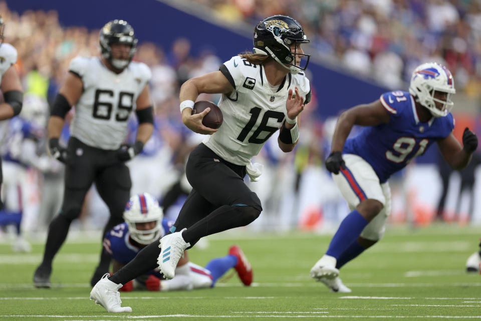 Jacksonville Jaguars quarterback Trevor Lawrence (16) runs with the ball during an NFL football game between Jacksonville Jaguars and Buffalo Bills at the Tottenham Hotspur stadium in London, Sunday, Oct. 8, 2023. (AP Photo/Ian Walton)