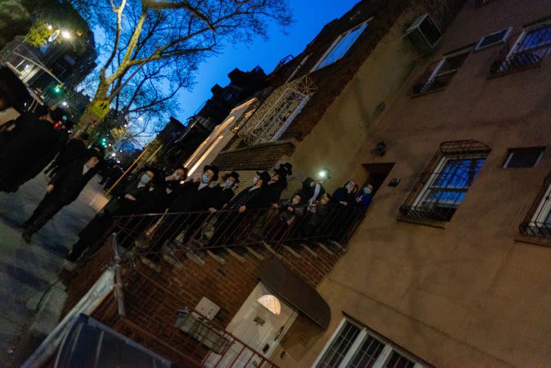 Jewish Hasidic community members gather for a funeral procession, during lockdown amid the coronavirus disease (COVID-19) outbreak, in Williamsburg