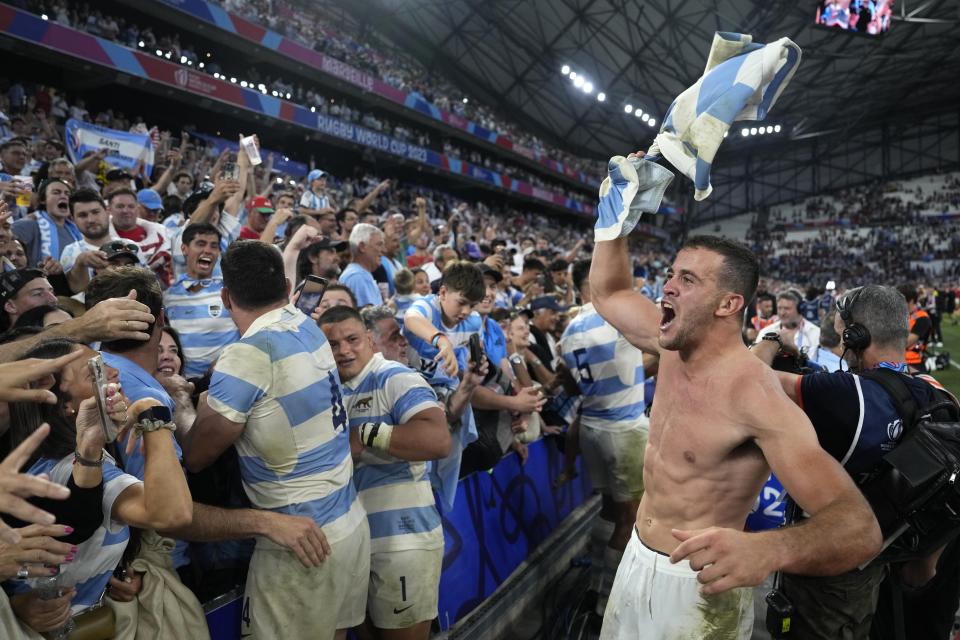 Argentina's Emiliano Boffelli celebrates with supporters at the end of the Rugby World Cup quarterfinal match between Wales and Argentina at the Stade de Marseille in Marseille, France, Saturday, Oct. 14, 2023. (AP Photo/Pavel Golovkin)