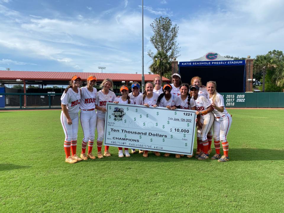 Mojo-Lunsford, a 16U travel softball team out of Suwanee, Ga., celebrates winning its division in PGF's Show Me The Money showcase from Katie Seashole Pressly Stadium on June 12.