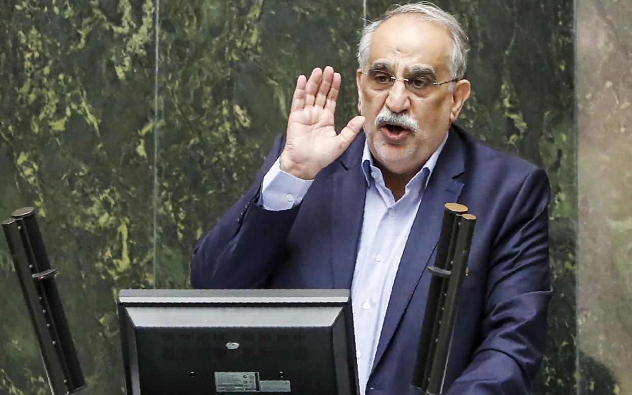 Masoud Karbasian, Iran's Economy Minister, speaks in the Iranian parliament before the vote that say him impeached - AFP