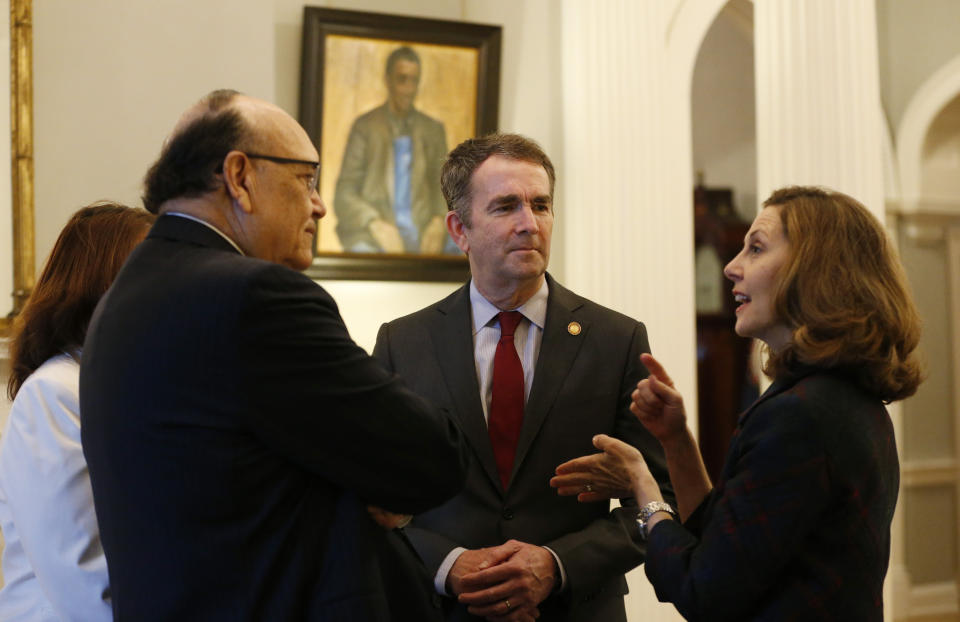 Virginia Gov. Ralph Northam, second from right, and his wife Pam, right, talk with former Virginia Union University president, Rev. Claude Perkins, second from left, and his wife, Cheryl, left, at a breakfast for the Richmond 34 at the Governors Mansion at the Capitol in Richmond, Va., Friday, Feb. 22, 2019. The breakfast was for The Richmond 34 were a group of African Americans who defied segregation laws in the 1960's (AP Photo/Steve Helber)