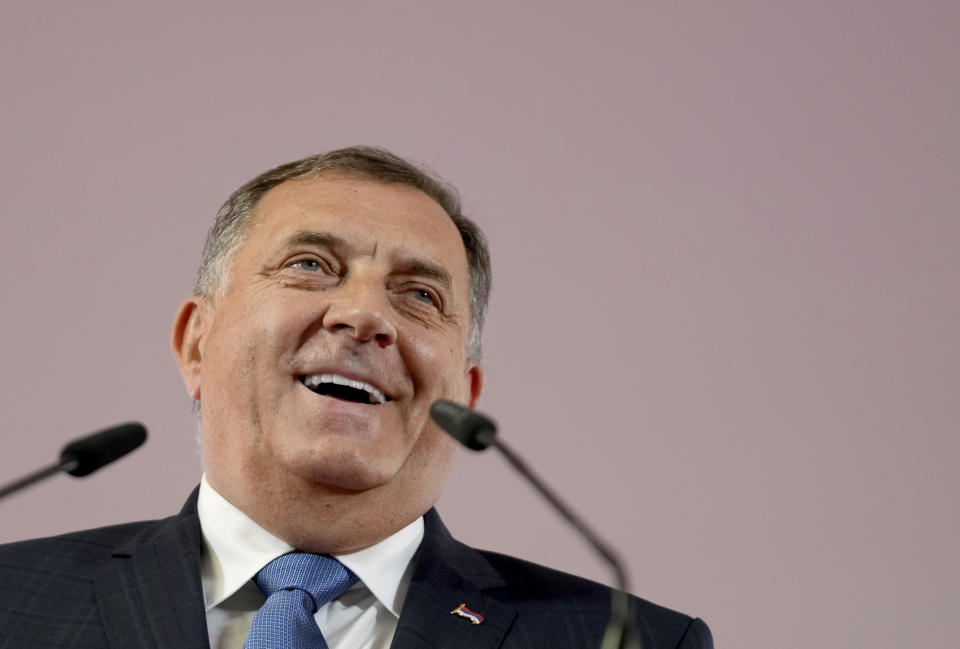 Bosnian Serb leader Milorad Dodik smiles during a news conference after claiming victory in a general election in the Bosnian town of Banja Luka, 240 kms northwest of Sarajevo, Monday, Oct. 3, 2022. Polls have closed Sunday in Bosnia's general election in which voters chose their new leaders from among the long-established cast of sectarian candidates and their challengers who pledged to eradicate, if elected, corruption and clientelism in government. (AP Photo/Darko Vojinovic)