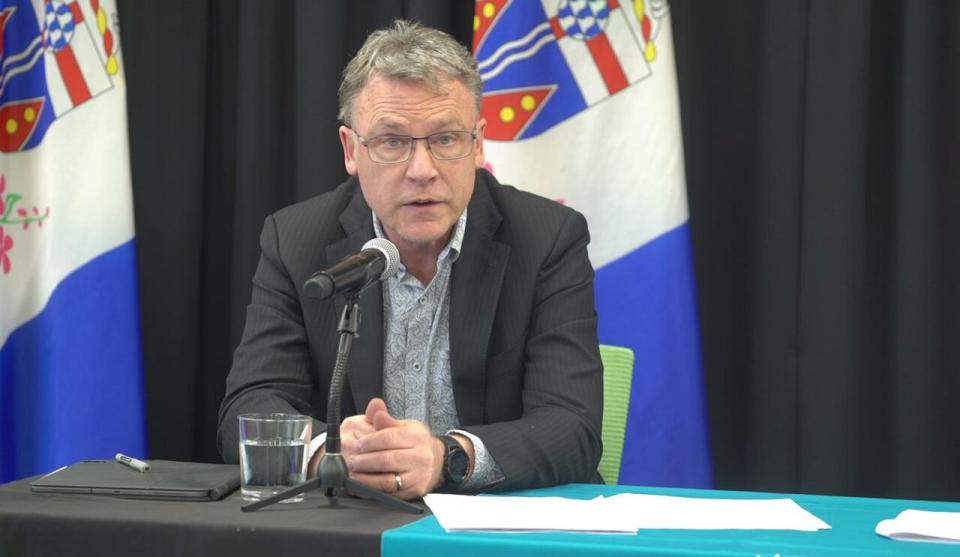 Yukon's Minister of Community Services Richard Mostyn speaks at a news conference in Whitehorse, March 6, 2024.