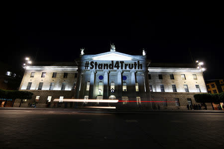 Projections in supporrt of victims of clerical abuse are seen on the General Post Office (GPO) as part of a protest, ahead of a visit by Pope Francis, in Dublin, Ireland August 24, 2018. REUTERS/Hannah McKay