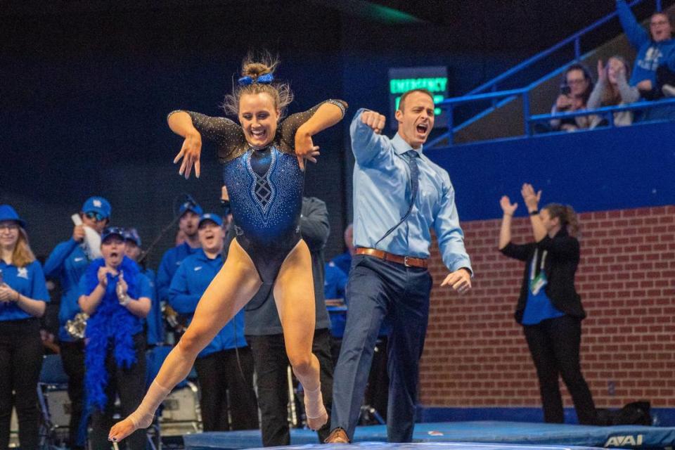 UK gymnast Raena Worley performs her floor routine while head coach Tim Garrison cheers in January 2023 at Rupp Arena.