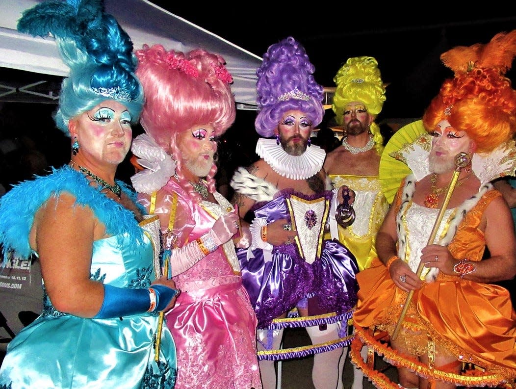 A group of attendees show off their very color-coordinated costumes at Halloween on Arenas, Oct. 31, 2021.