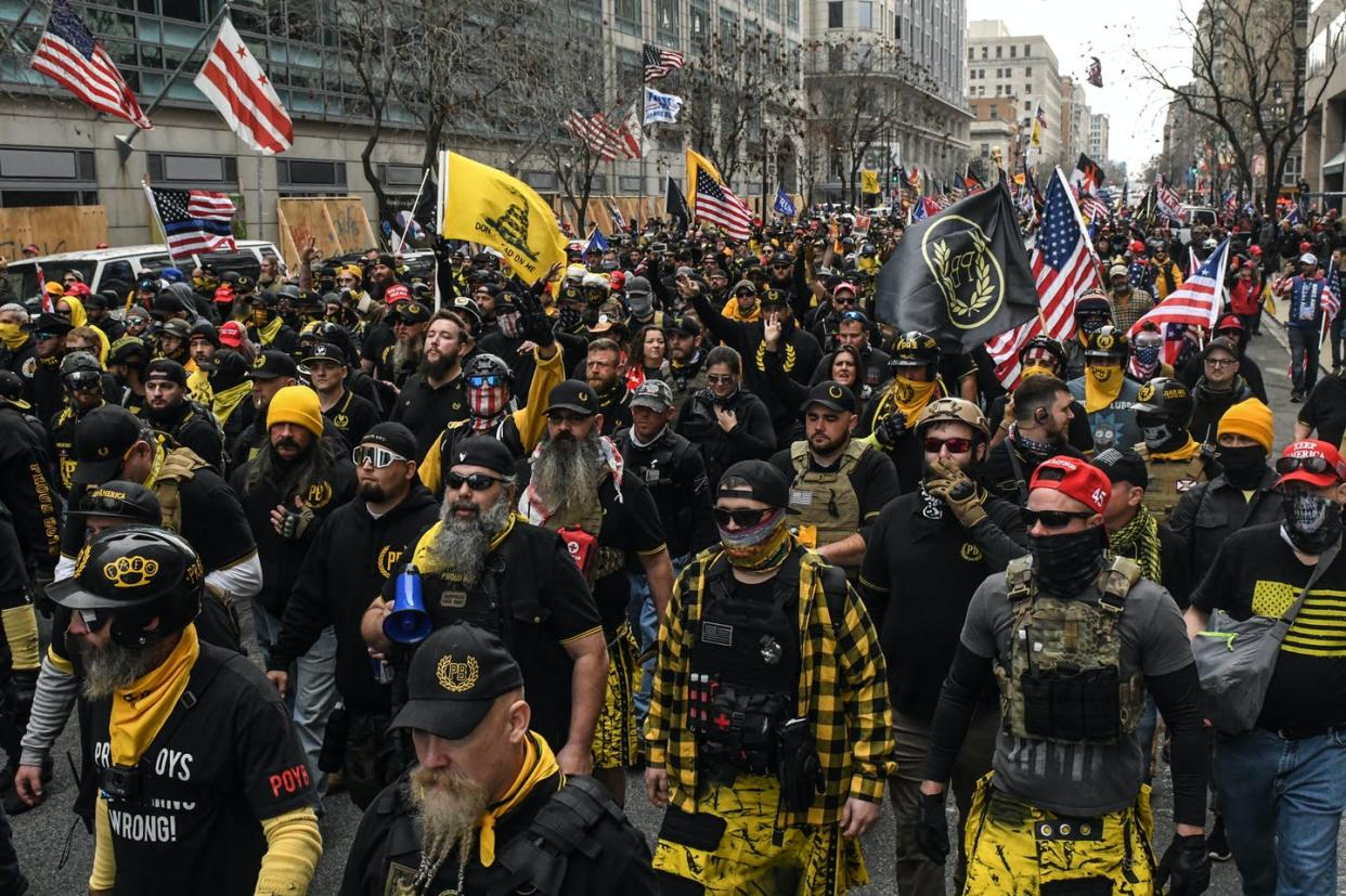 <span class="caption">Far-right groups like the Proud Boys, seen here marching in Washington, D.C., on Dec. 12, are increasingly organizing their activities on messaging services like Telegram.</span> <span class="attribution"><a class="link " href="https://www.gettyimages.com/detail/news-photo/members-of-the-proud-boys-march-towards-freedom-plaza-news-photo/1230087058?adppopup=true" rel="nofollow noopener" target="_blank" data-ylk="slk:Stephanie Keith/Getty Images;elm:context_link;itc:0;sec:content-canvas">Stephanie Keith/Getty Images</a></span>