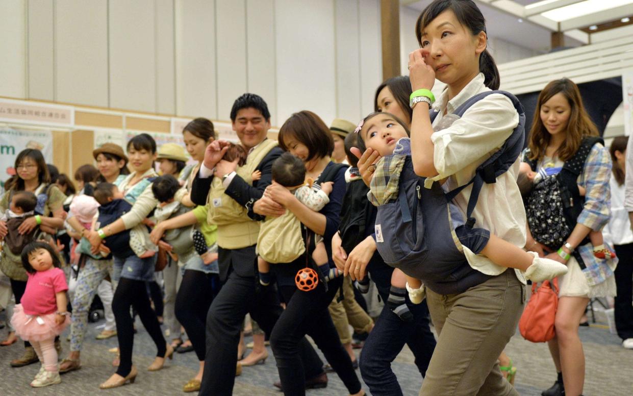 Women are still often expected to give up work after having children in Japan - AFP