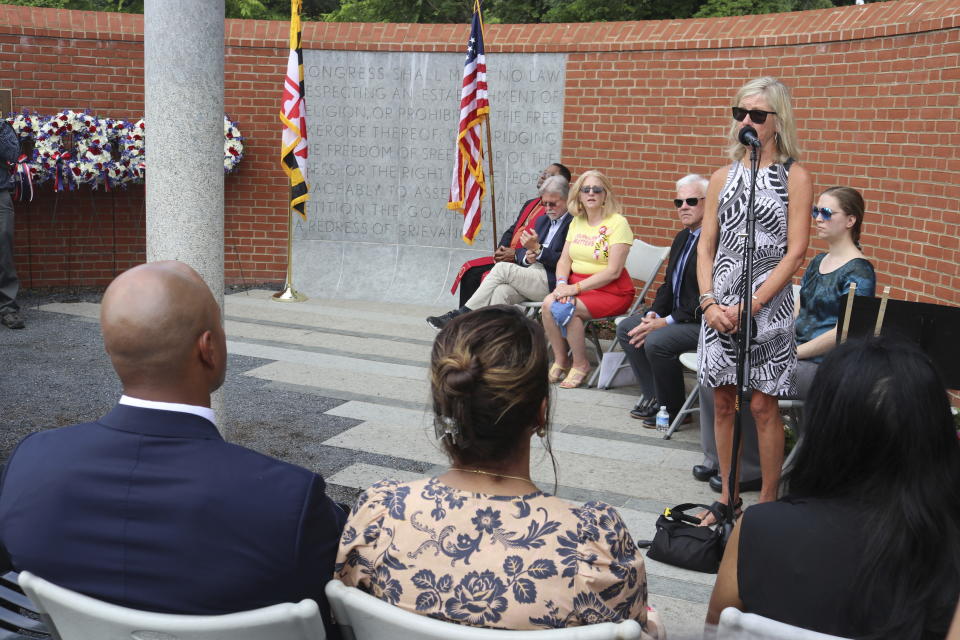 Maria Hiaasen, the widow of slain newspaper editor Rob Hiaasen, speaks during a wreath-laying ceremony at the Guardians of the First Amendment Memorial on Wednesday, June 28, 2023, in Annapolis, Md., on the fifth anniversary of the attack on the Capital Gazette newspaper that killed five people. (AP Photo/Brian Witte)
