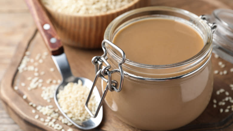 Jar of sesame paste and seeds