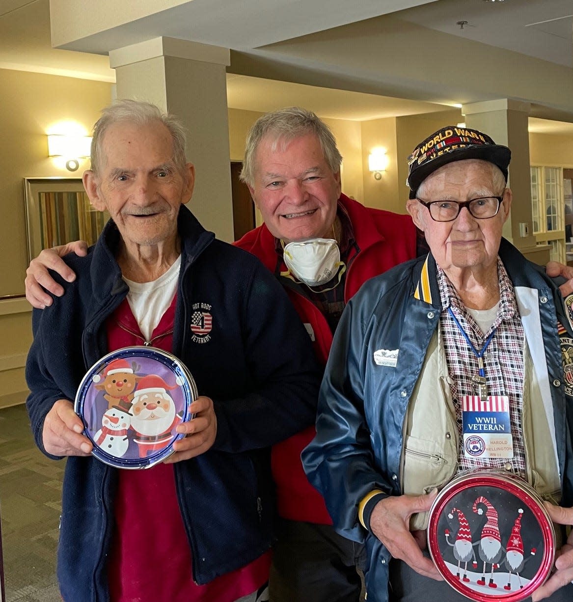 From left to right are World War II veteran Joe Cooper and museum volunteers Mike McCarthy and WWII veteran Harold Wellington.
