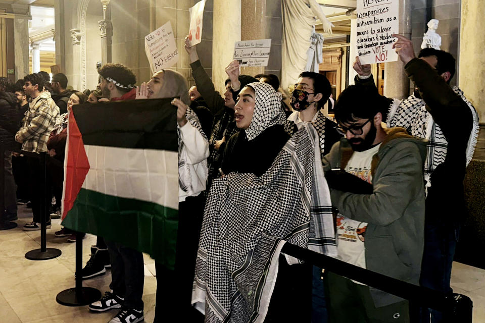 FILE - Protestors rally outside of the Indiana House chamber against House Bill 1002, which defines antisemitism and bans its teaching at Indiana schools, Jan 18, 2024, in Indianapolis. A handful of U.S. states are considering measures that would define antisemitism, but there's debate over whether they would stifle criticism of Israel. (AP Photo/Isabella Volmert, file)