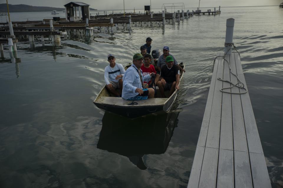 People at a harbor in Boquerón, Puerto Rico, to move boats for protection ahead of the arrival of Tropical Storm Dorian on Aug. 27. (Photo: Ramon Espinosa/AP)