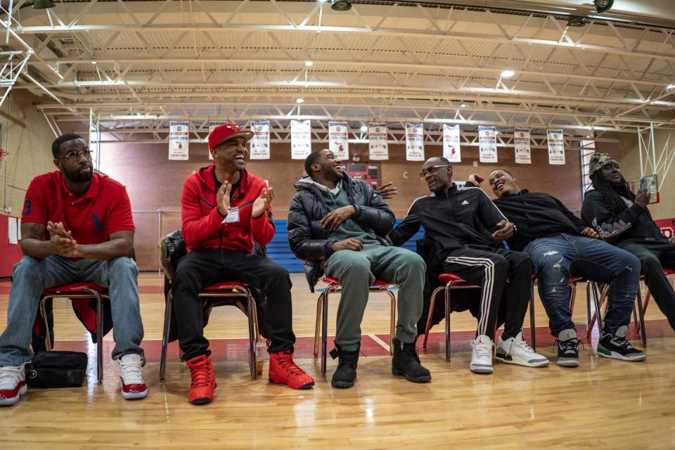 Thelonious Searcy, left, involved with the 4s and 5s; Deonte Morris, 35, of Detroit, a member of the 4s; Darnell Canady, 31, of Detroit, a member of the 4s; David Daniels, 43, of Detroit, a member of the 5s; Jerry McQueen, associated with the 5s, and Pierre Knight, 25, of Detroit, a former member of 5s, react to a speaker while talking to Osborn High School students as rival gang members from the 4s and 5s unite to preach peace and an end to violence in the aftermath of the killing of 11-year-old Latrelle Mines in early January during an assembly at Osborn High School on Friday, Feb. 2, 2023.