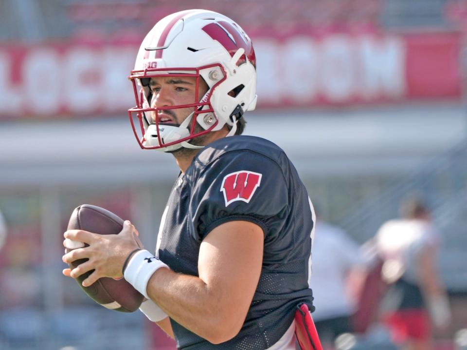 Wisconsin Badgers quarterback <a class="link " href="https://sports.yahoo.com/ncaaf/players/292020" data-i13n="sec:content-canvas;subsec:anchor_text;elm:context_link" data-ylk="slk:Tanner Mordecai;sec:content-canvas;subsec:anchor_text;elm:context_link;itc:0">Tanner Mordecai</a> (8) runs through a drill during fall training camp at Camp Randall Stadium in Madison on Thursday, Aug. 10, 2023.