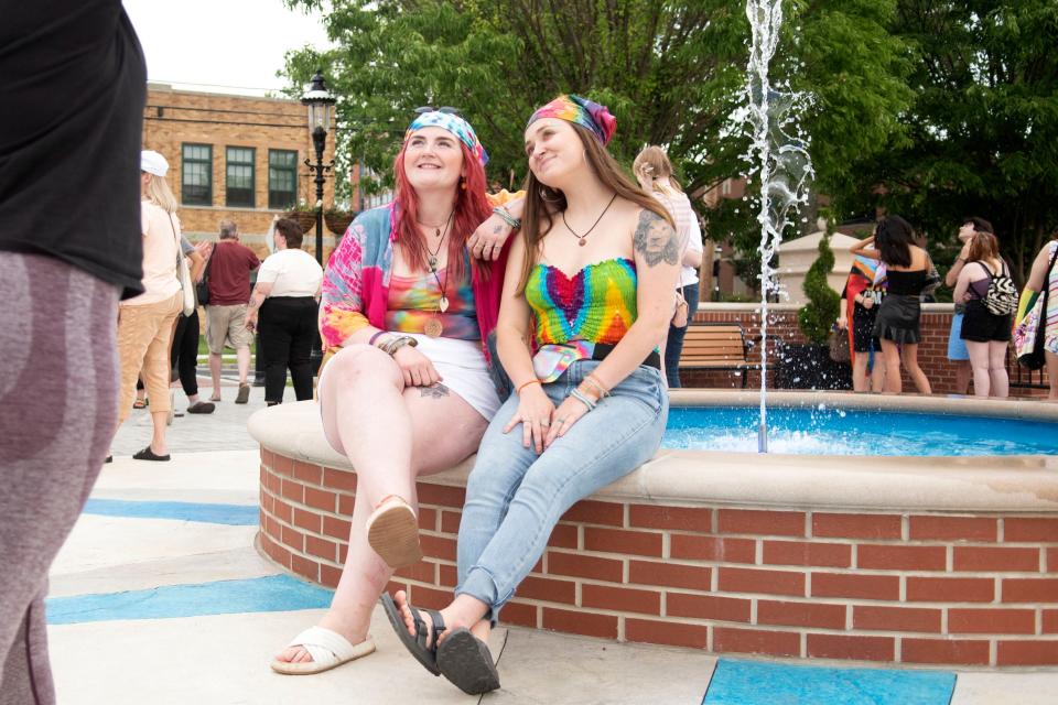 Savannah Raphial, left, and Darrah Warshel pose for photos after the LGBTQ+ flag-raising event in front of the Doylestown Borough Hall on Wednesday, June 1, 2022.