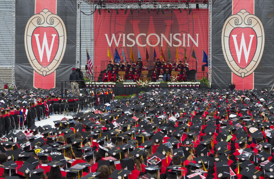 FILE - The commencement address is given during graduation at the University of Wisconsin in Madison, Wis., on May 12, 2018. The Universities of Wisconsin and Assembly Republican Speaker Robin Vos have reached a sweeping deal released Friday, Dec. 8, 2023, that would freeze hiring for diversity positions across the system in exchange for lawmakers approving employee pay raises and funding for a new engineering building at the flagship campus. Vos blocked pay raises and Republicans refused to release money for the engineering building earlier this year. (AP Photo/Jon Elswick, File)