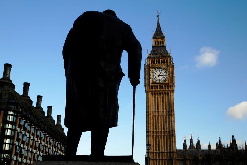 FILE PHOTO: The statue of Britain's former Prime Minister Winston Churchill is silhouetted in front of the Houses of Parliament in London