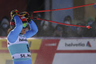Italy's Federica Brignone celebrates in the finish area of an alpine ski, women's World Cup super-G in St. Moritz, Switzerland, Sunday, Dec. 12, 2021. (AP Photo/Marco Trovati)