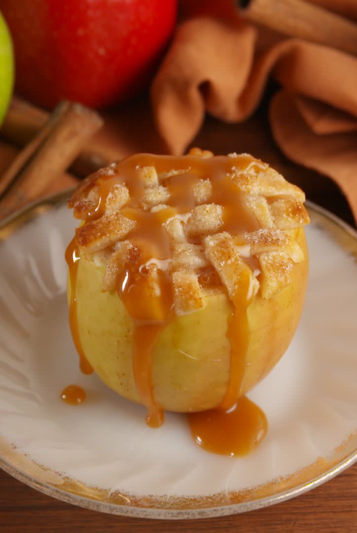 <p>These apple pies are the cutest things you'll see all winter. Topped with a lattice crust and plenty of caramel, these are the perfect thing to serve in place of apple pie!</p><p>Get the <a href="https://www.delish.com/uk/cooking/recipes/a29781431/apple-pie-baked-apples-recipe/" rel="nofollow noopener" target="_blank" data-ylk="slk:Apple Pie Baked Apples;elm:context_link;itc:0;sec:content-canvas" class="link ">Apple Pie Baked Apples</a> recipe.</p>