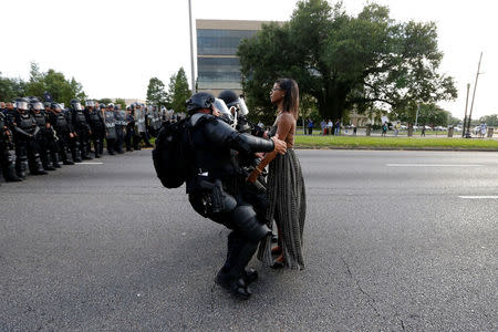 Protestor Ieshia Evans is detained by law enforcement near the headquarters of the Baton Rouge Police Department in Baton Rouge, Louisiana, U.S. July 9, 2016. REUTERS/Jonathan Bachman