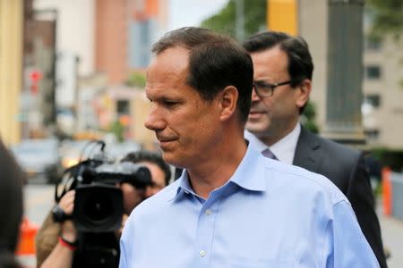 Ted Huber (C), employee of the healthcare investment fund Deerfield Management, departs Federal Court in Manhattan after an arraignment for insider trading in New York, U.S., May 24, 2017. REUTERS/Lucas Jackson