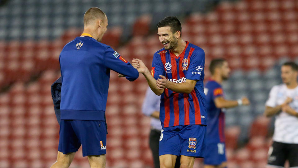 Seen here, the Newcastle Jets celebrate their win before the A-League season was suspended.