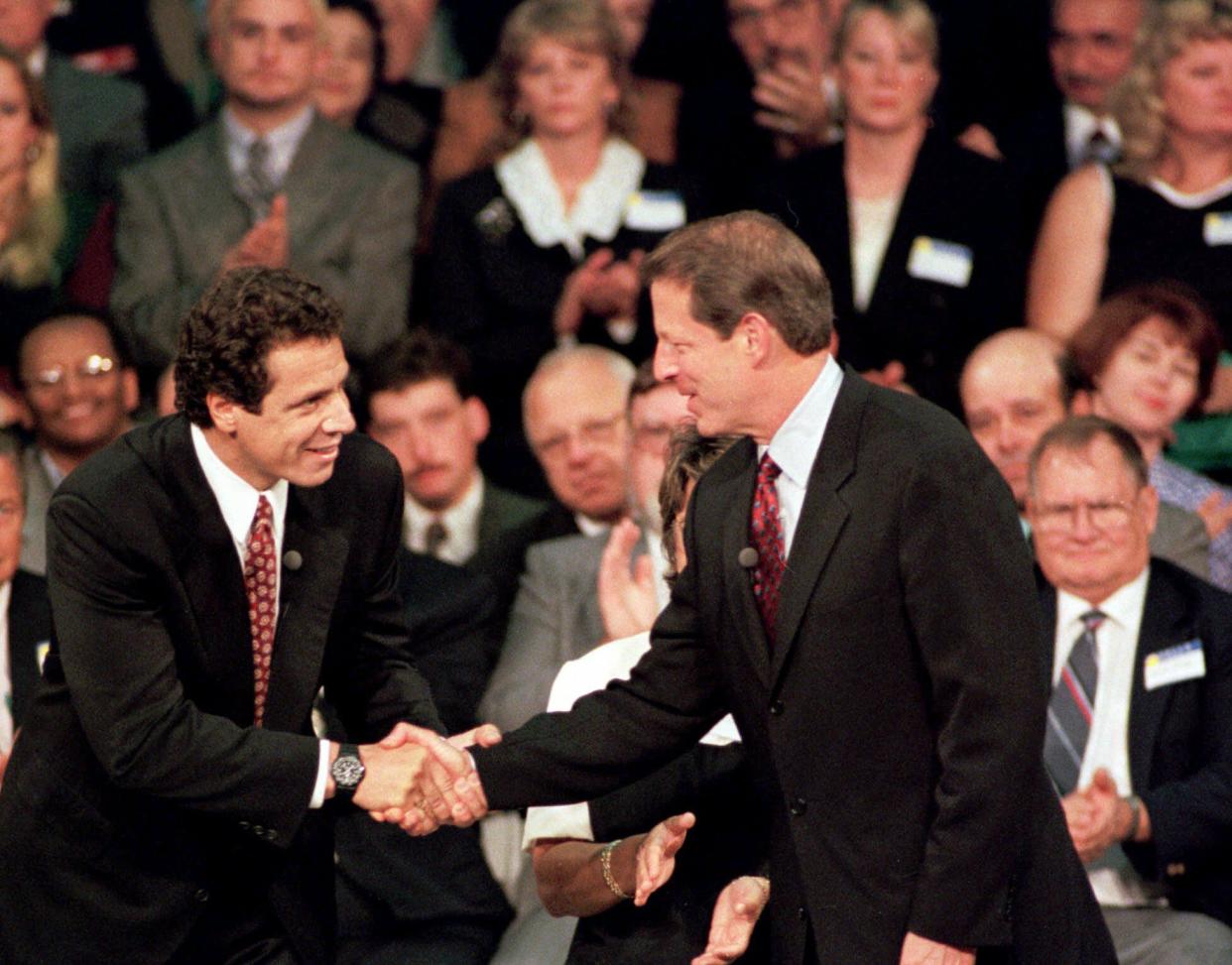 Vice President Al Gore, right, shakes hands with Housing Secretary Andrew Cuomo, left, Thursday, Sept. 30, 1999, at the Fulton-Montgomery Community College in Johnstown, N.Y. Gore was in the economically distressed area of upstate New York as he sought to pump new energy into his presidential campaign.