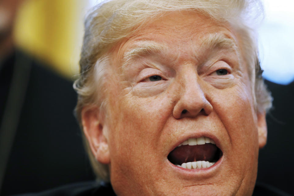 President Donald Trump speaks before signing H.R. 390, the "Iraq and Syria Genocide Relief and Accountability Act of 2018," in the Oval Office of the White House, Tuesday, Dec. 11, 2018, in Washington. (AP Photo/Jacquelyn Martin)