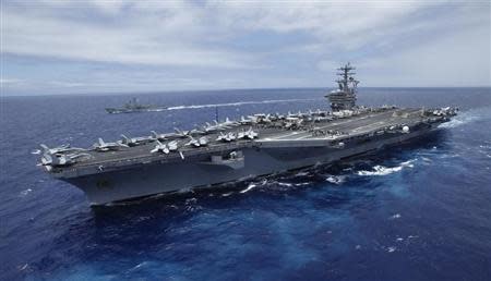 The USS Nimitz sails about 150 miles north of the island of Oahu during the RIMPAC Naval exercises off Hawaii July 18,2012. REUTERS/Hugh Gentry