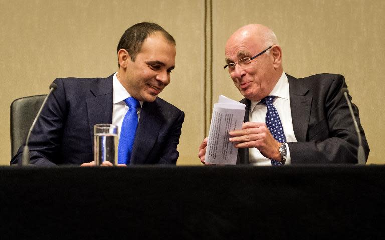 President of the Royal Dutch Football Association Michael van Praag (R), and FIFA Vice-President, Jordan's Prince Ali bin al-Hussein give a press conference in Amsterdam, on May 21, 2015