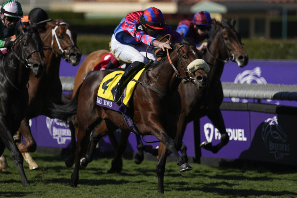 Tom Marquand rides Big Evs, center, to win the Breeders' Cup Juvenile Turf Sprint horse race Friday, Nov. 3, 2023 at Santa Anita Park in Arcadia, Calif. (AP Photo/Ashley Landis)