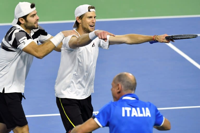 Italy's Simone Bolelli and Andreas Seppi celebrate after winning the third game of their Davis Cup World Group quarter-final against Belgium, in Charleroi, on April 8, 2017