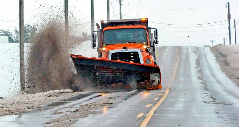 Thhis county plow truck makes another sweep near Kidron.