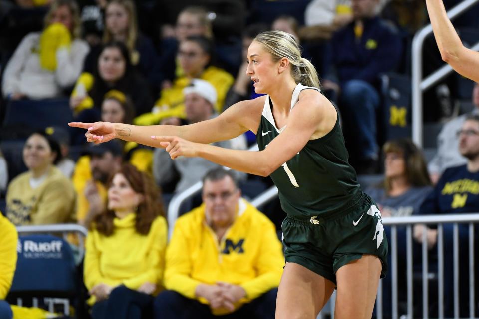 Michigan State guard Tory Ozment reacts after making a 3-point shot during the second half of an NCAA college basketball game against Michigan, Sunday, Feb. 18, 2024, in Ann Arbor, Mich. (AP Photo/Jose Juarez)