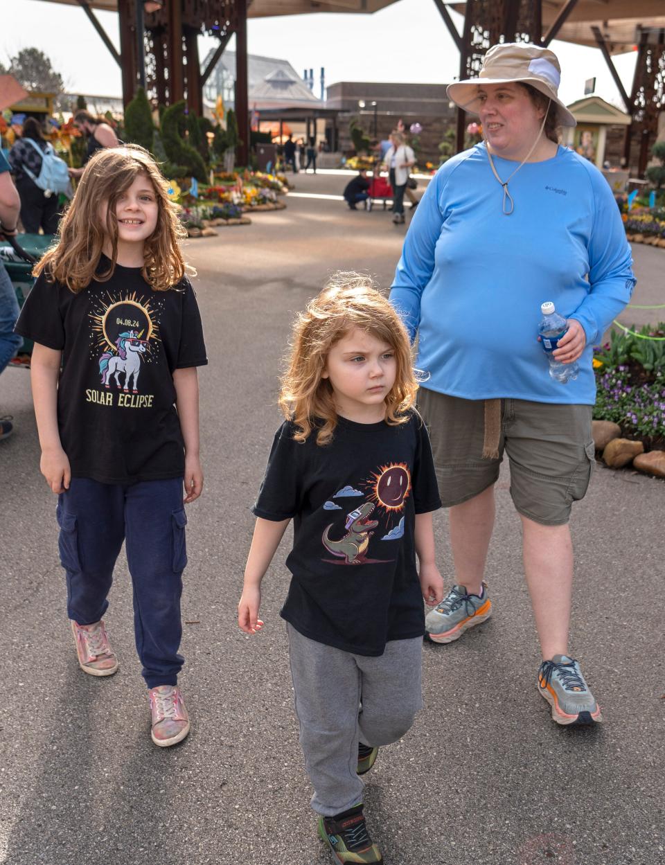 Sawyer, Wren and Julia Ronashko enjoy the day Monday, April 8, 2024 at the Indianapolis Zoo. Indianapolis is in the path of totality of the eclipse. The Zoo was one location peo[ple are going to for the eclipse. People can also be scientists, gathering info for study as to what the animals do during a total eclipse.