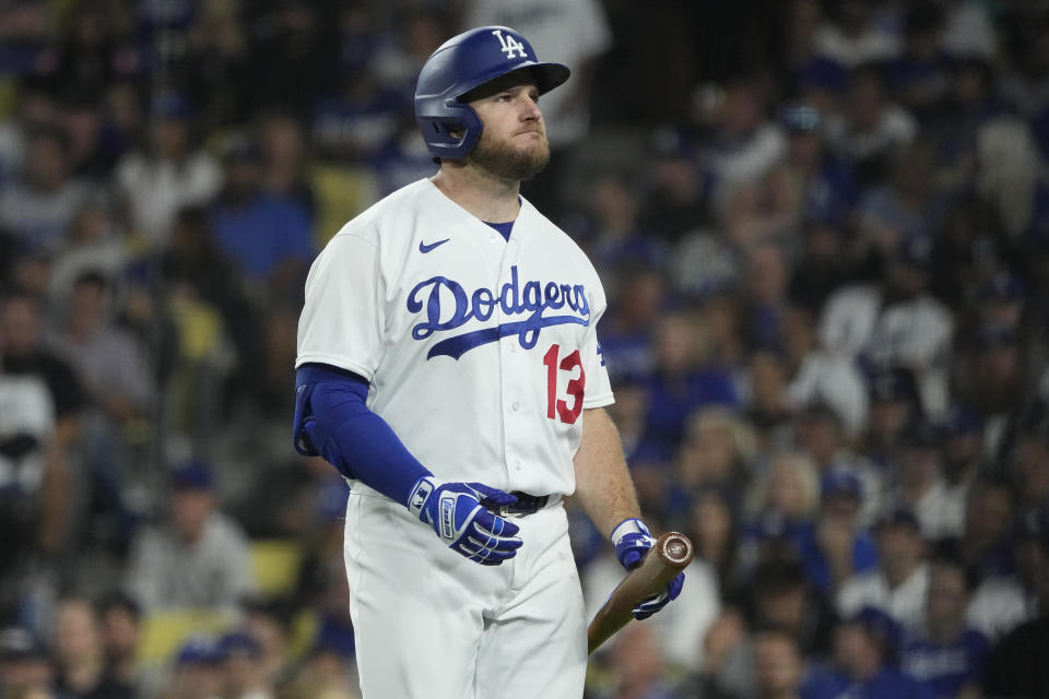 Los Angeles Dodgers' Max Muncy walks back to the dugout after striking out during the eighth inning in Game 2 of a baseball NL Division Series against the Arizona Diamondbacks, Monday, Oct. 9, 2023, in Los Angeles. (AP Photo/Mark J. Terrill)