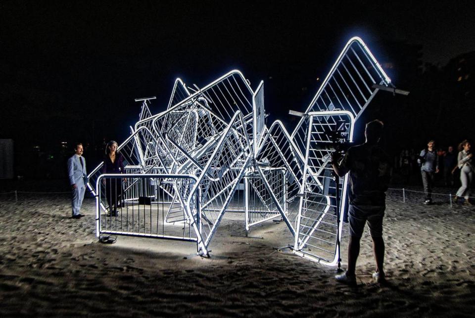 Cuban-American artists Antonia Wright and Rubén Millares (far left), stand by their piece titled titled “Patria y Vida” a large-scale light sculpture that celebrates people’s right to peacefully protest including Cuba where many were sentenced to prison after the anti-government protests that took place on July 11th, 2021. This project is part of the City of Miami Beach’s A No Vacancy Project in partnership with Faena Art, for the Miami Art Week 2022, on Tuesday November 12, 2022.