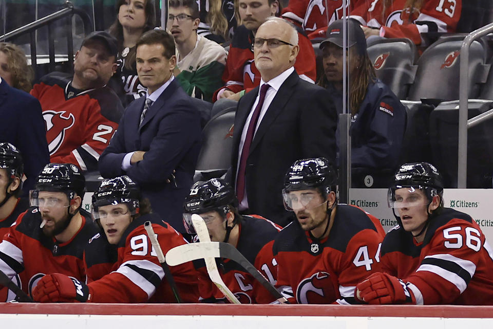 New Jersey Devils head coach Lindy Ruff looks on in the third period of an NHL hockey game against the Detroit Red Wings Saturday, Oct. 15, 2022, in Newark, N.J. The Red Wings won 5-2. (AP Photo/Adam Hunger)