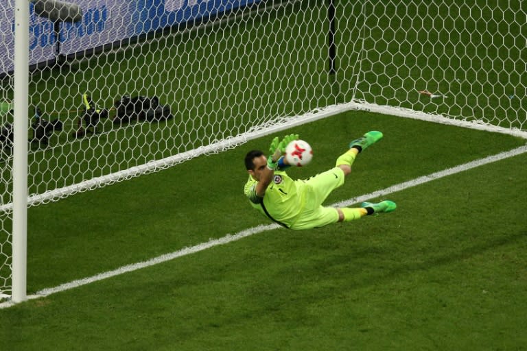 Chile's goalkeeper Claudio Bravo deflects the ball in the penalty shoot out during the 2017 Confederations Cup semi-final football match against Portugal June 28, 2017