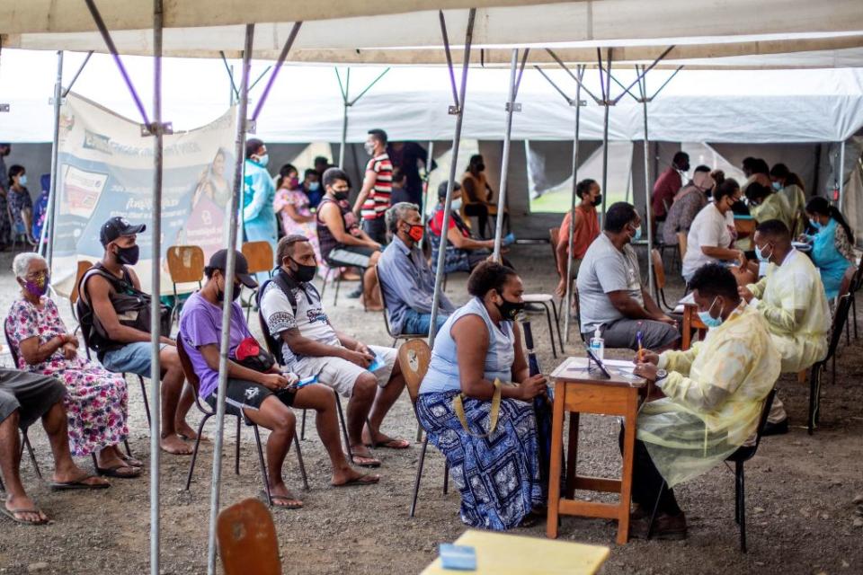 Fijians queueing for a dose of AstraZeneca. Source: Getty