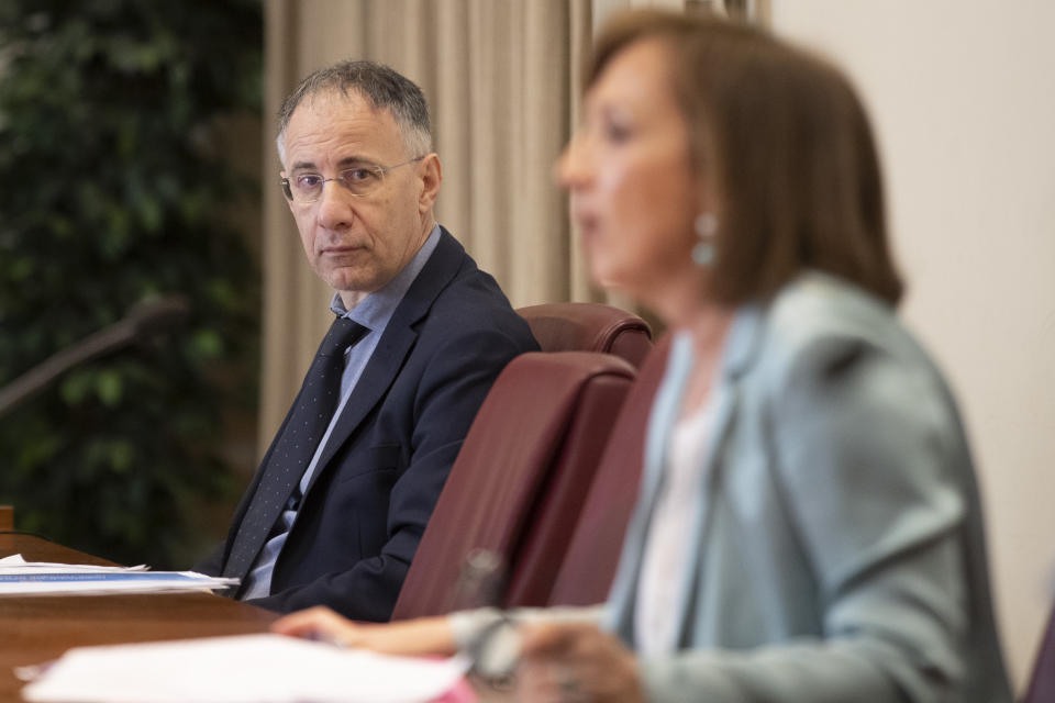 General Manager of the Gaslini children's hospital in Genoa, Paolo Petralia, left, listens to Sandra Zampa, Health Ministry Undersecretary, during a press conference at the Italian Health Ministry to present the results of an investigation on the psychological and behavioral impact the coronavirus lockdown has had on children and adolescents in Italy, in Rome, Tuesday, June 16, 2020. (AP Photo/Alessandra Tarantino)