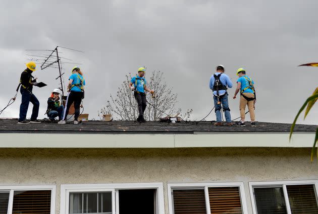 Students from the University of Michigan learn how to install a rooftop solar system at a home in Long Beach, California, in 2019. (Photo: Long Beach Press-Telegram via Getty Images)